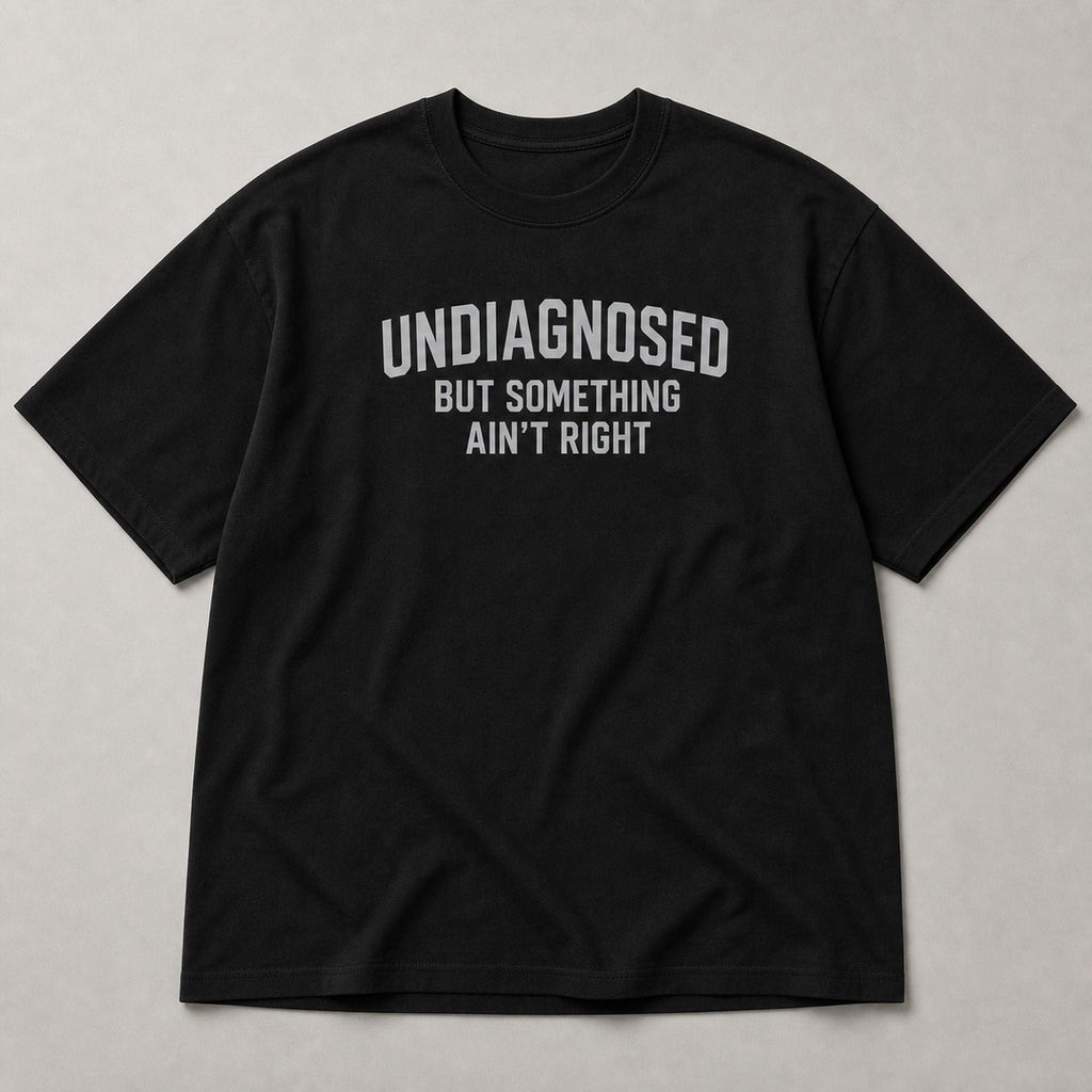 Undiagnosed But Something Ain't Right funny graphic tee black front flat lay