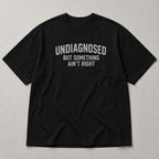 Undiagnosed But Something Ain't Right funny graphic tee black front flat lay