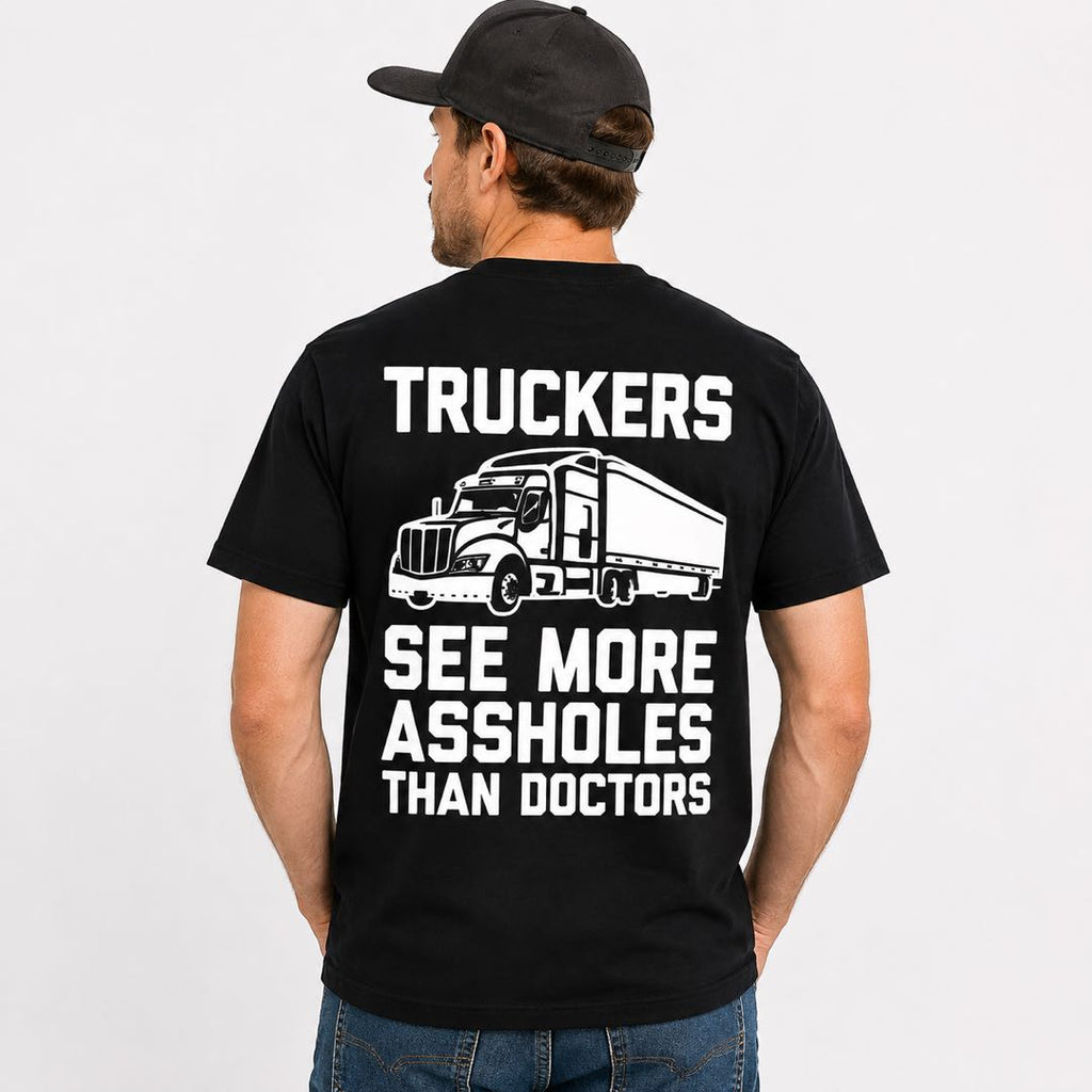 Truckers See More Assholes Than Doctors Funny T-Shirt | Trucker Humor Graphic Tee | Funny Gift for Truck Drivers