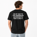 Viral “Take A She/It” Graphic Tee | Funny Genderless Bathroom Meme Shirt | Unisex Humor T-Shirt